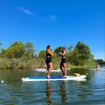 girls sharing paddleboard