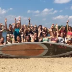 group photo by the water