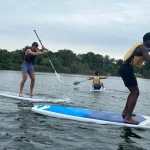 paddleboarding 3 guys