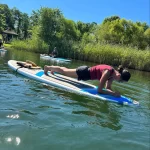 yoga on paddleboard lying down